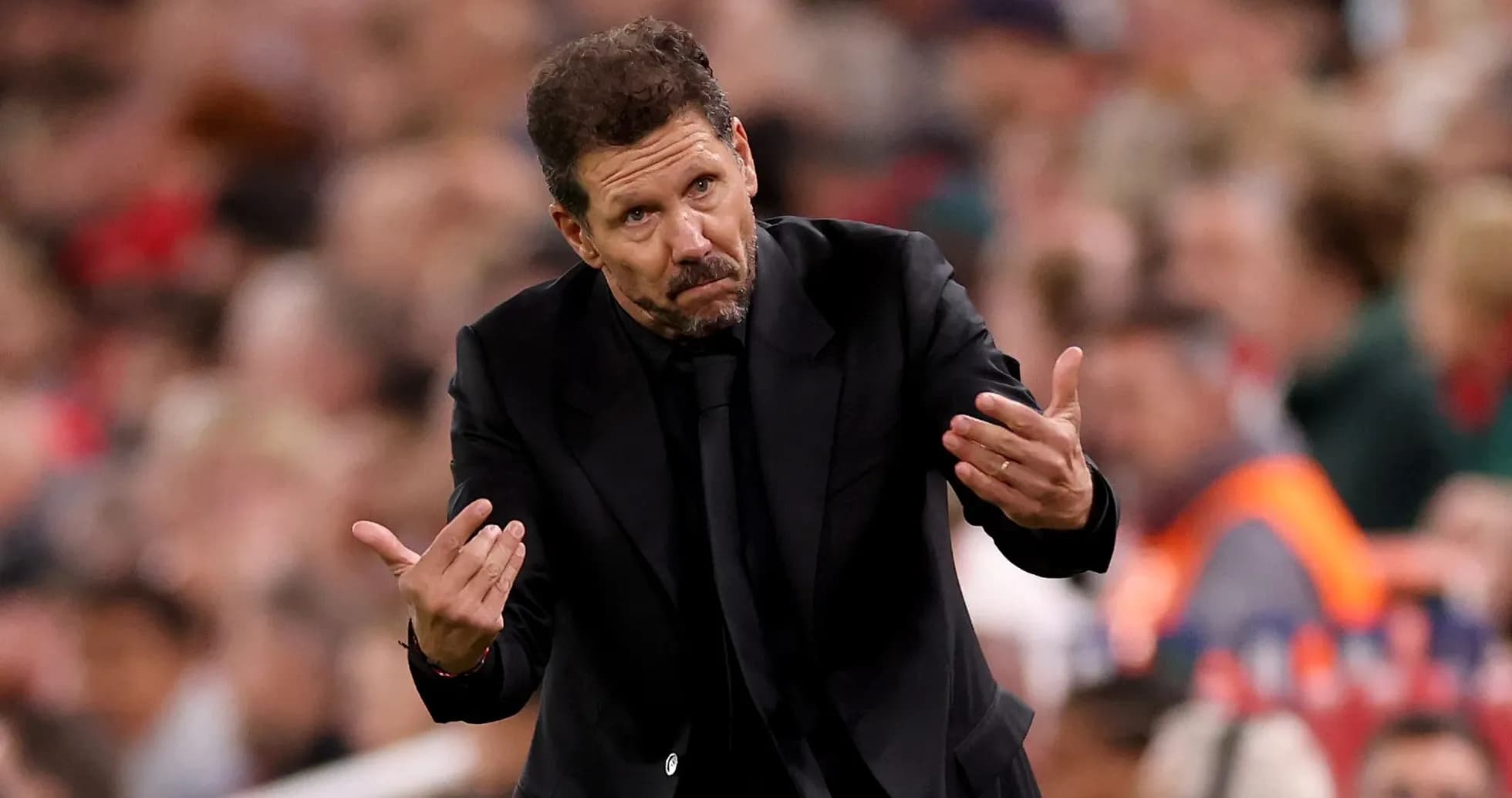 Coach gesturing during a match on the sideline Coach gesturing during a match on the sideline