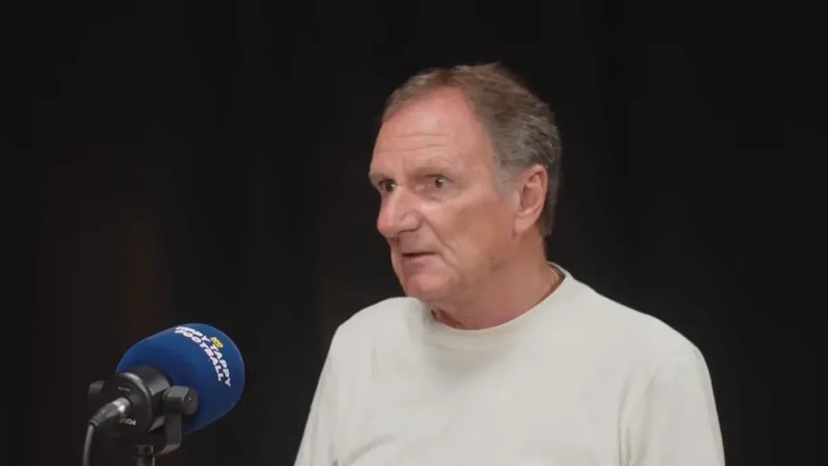 Man speaking at a microphone during an interview Man speaking at a microphone during an interview