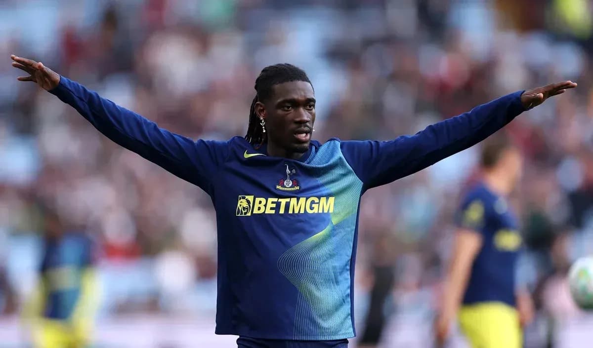 Player warming up with arms outstretched on field Player warming up with arms outstretched on field