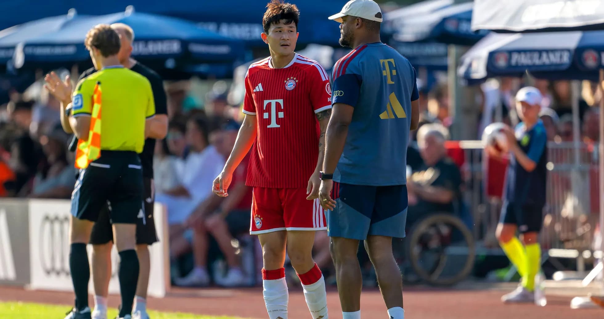 Bayern Munich player speaking with coach during match Bayern Munich player speaking with coach during match