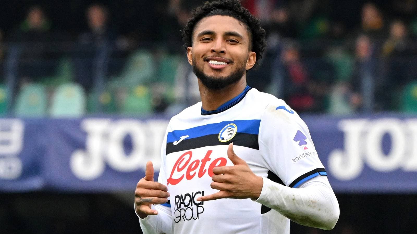Player celebrating with thumbs up on the field Player celebrating with thumbs up on the field