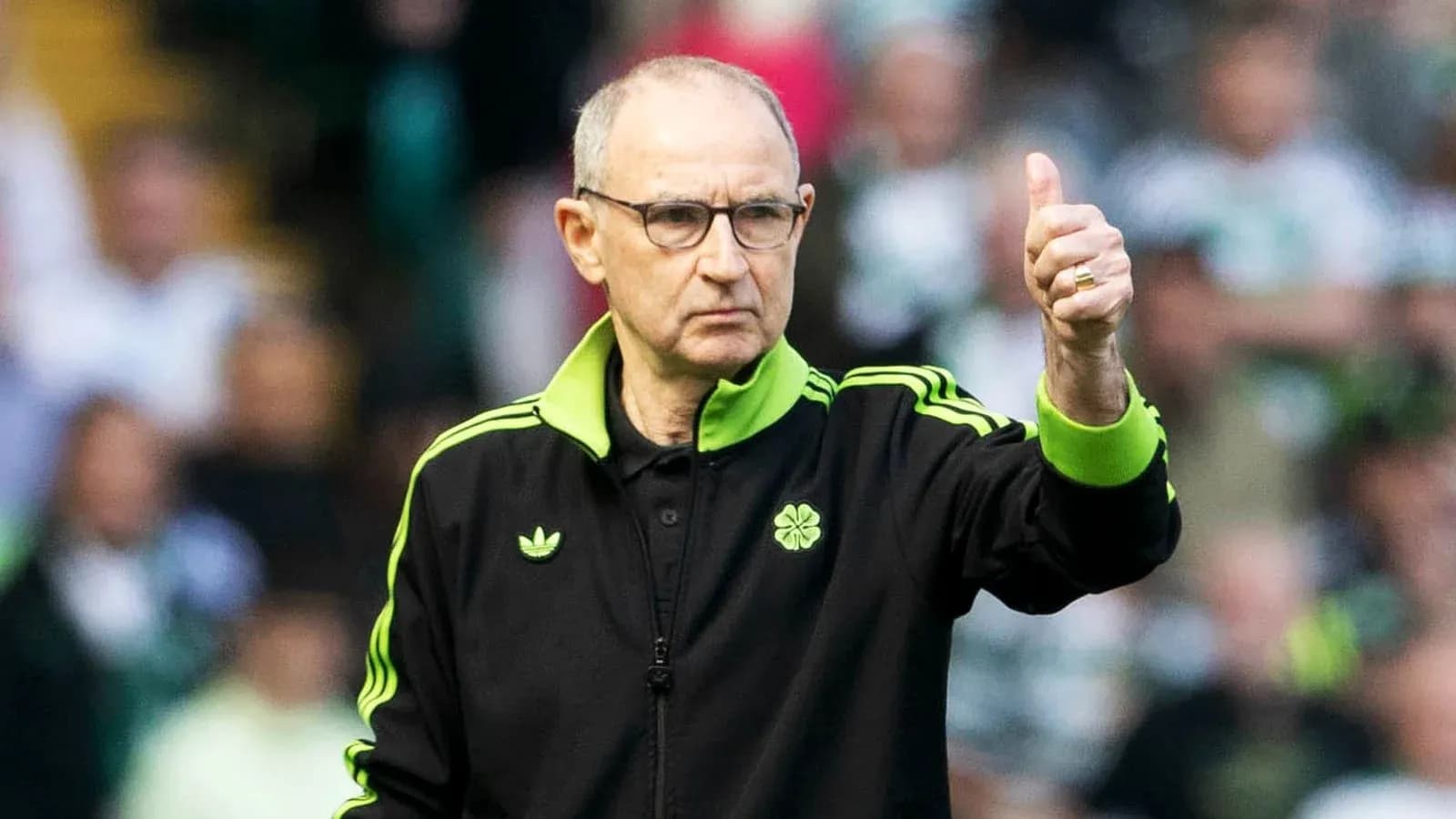 Manager giving a thumbs up during match Manager giving a thumbs up during match