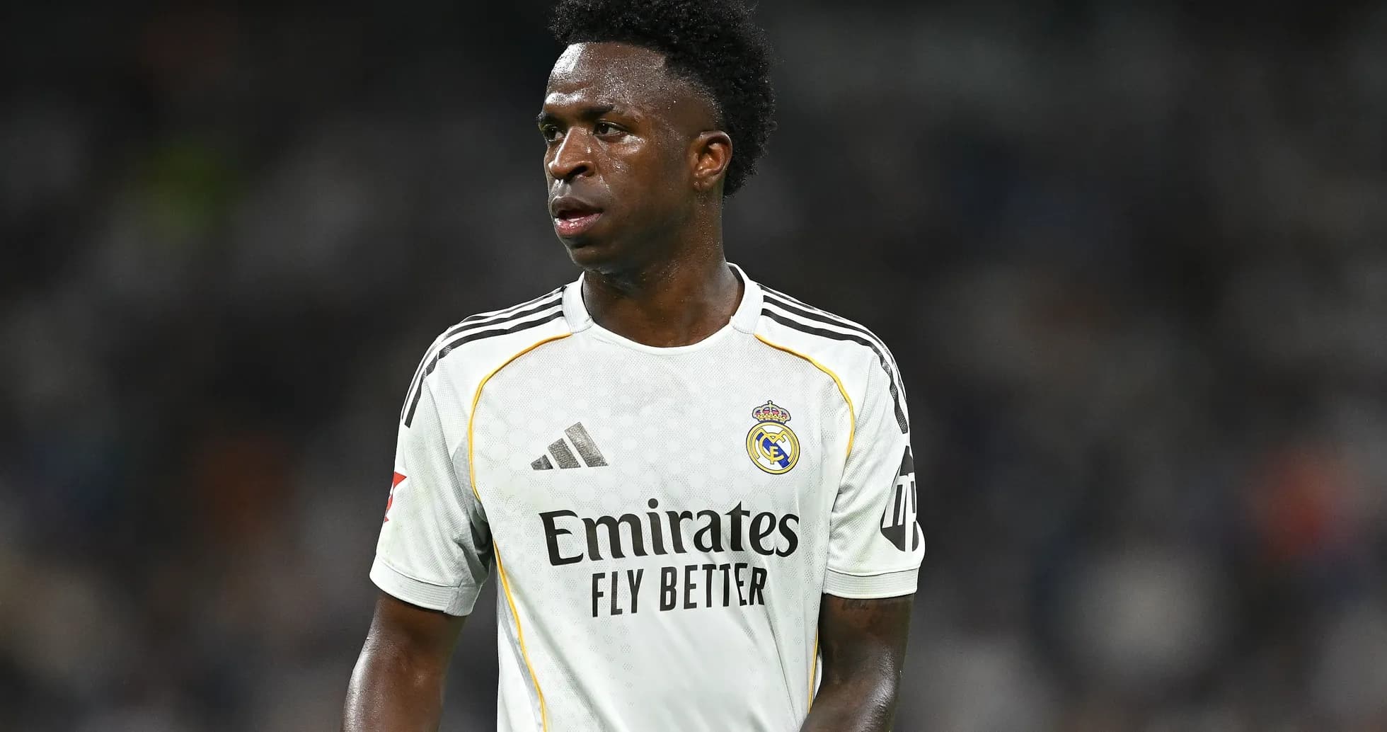 Vinícius Júnior wearing Real Madrid kit on field Vinícius Júnior wearing Real Madrid kit on field
