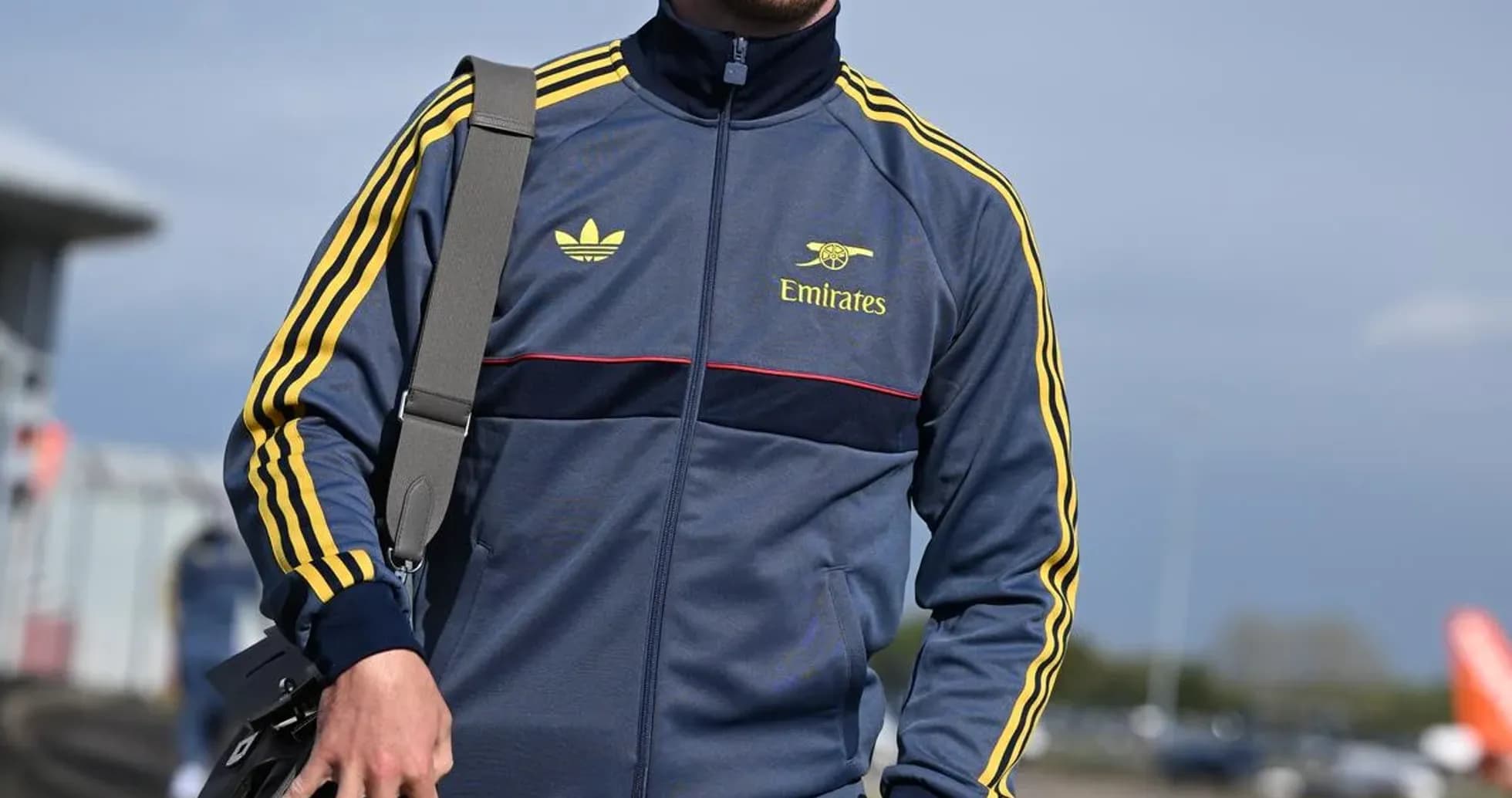Athlete walking in sportswear with bag Athlete walking in sportswear with bag