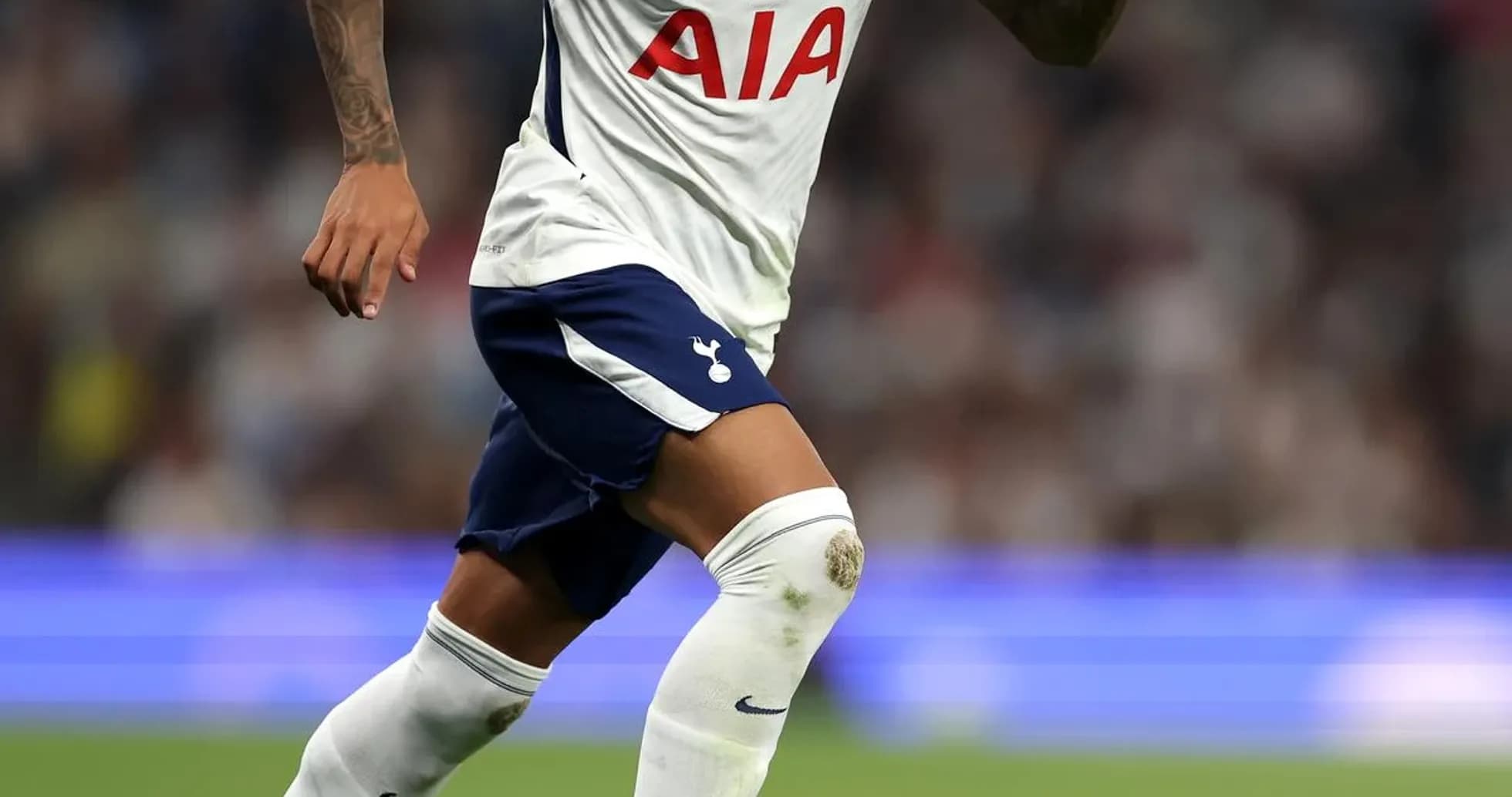 Player running with ball during match for Tottenham Player running with ball during match for Tottenham