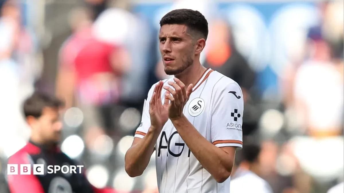 Swansea City player clapping to fans after match Swansea City player clapping to fans after match