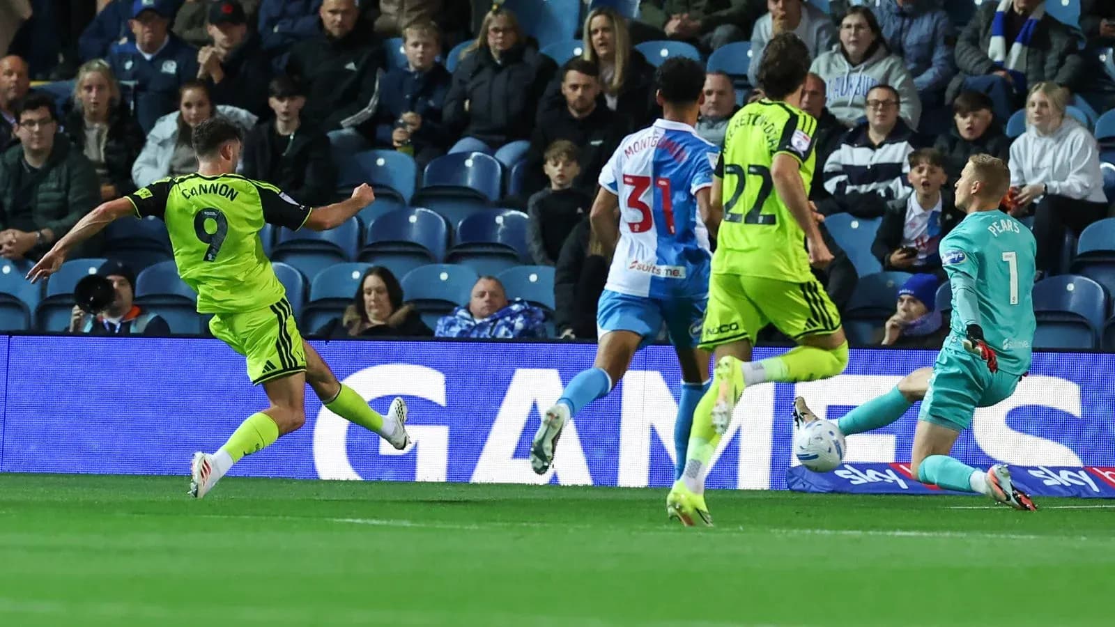 Player shooting towards goal during match action Player shooting towards goal during match action