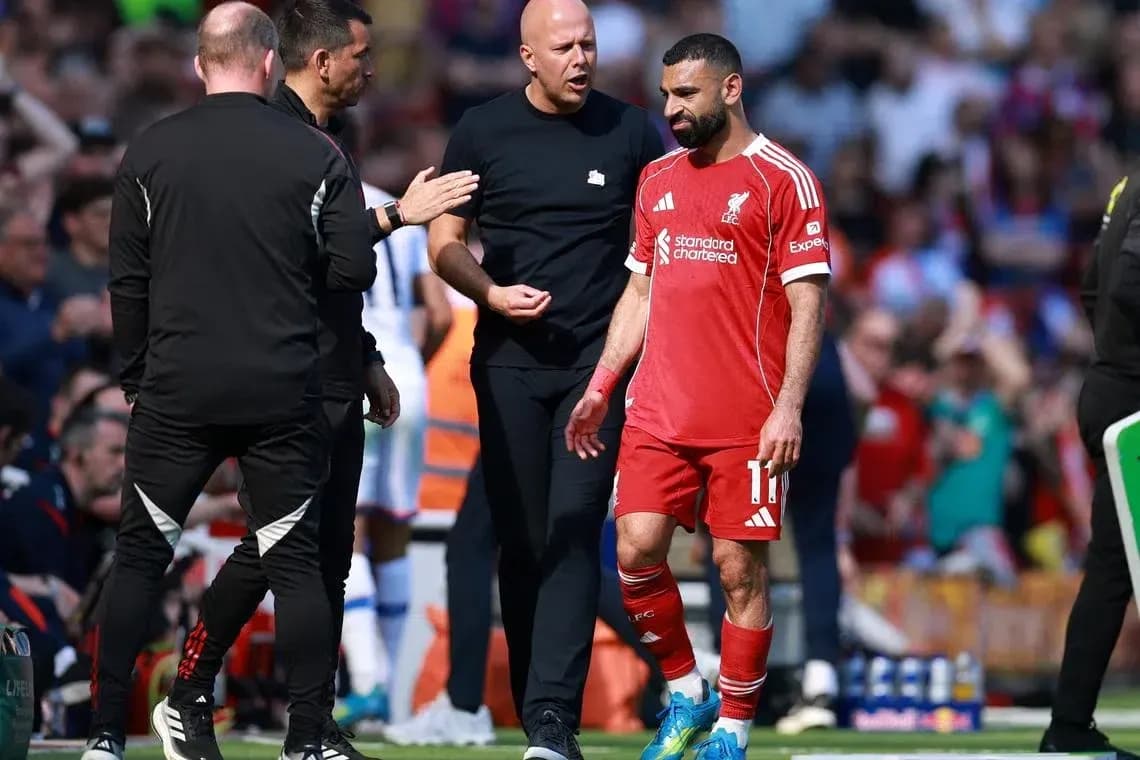 Mohamed Salah walking off field with coaches Mohamed Salah walking off field with coaches