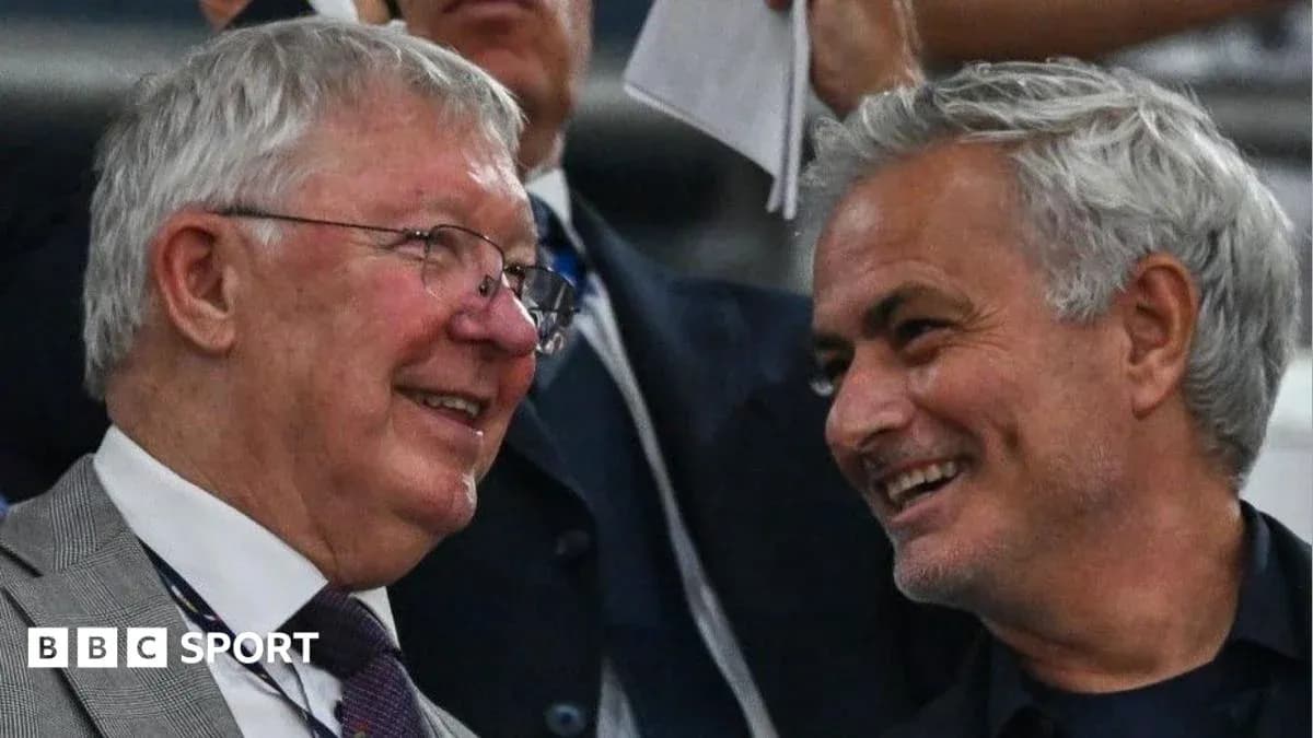 Two coaches smiling and conversing in stands Two coaches smiling and conversing in stands
