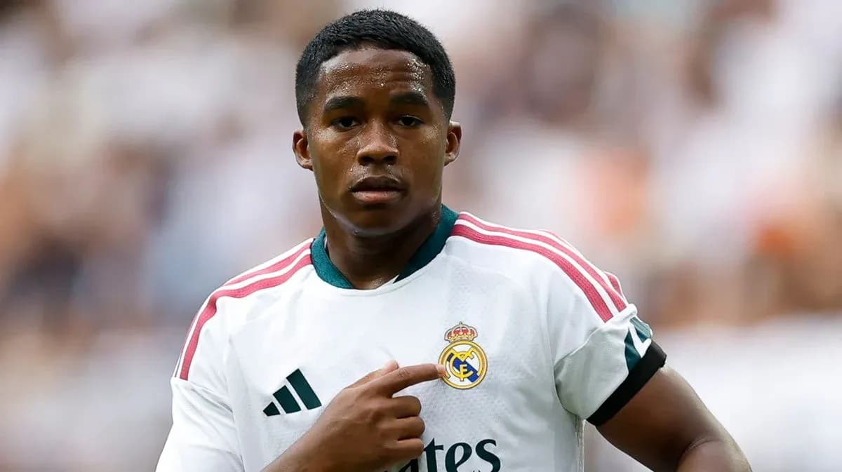 Player pointing to Real Madrid crest on jersey Player pointing to Real Madrid crest on jersey