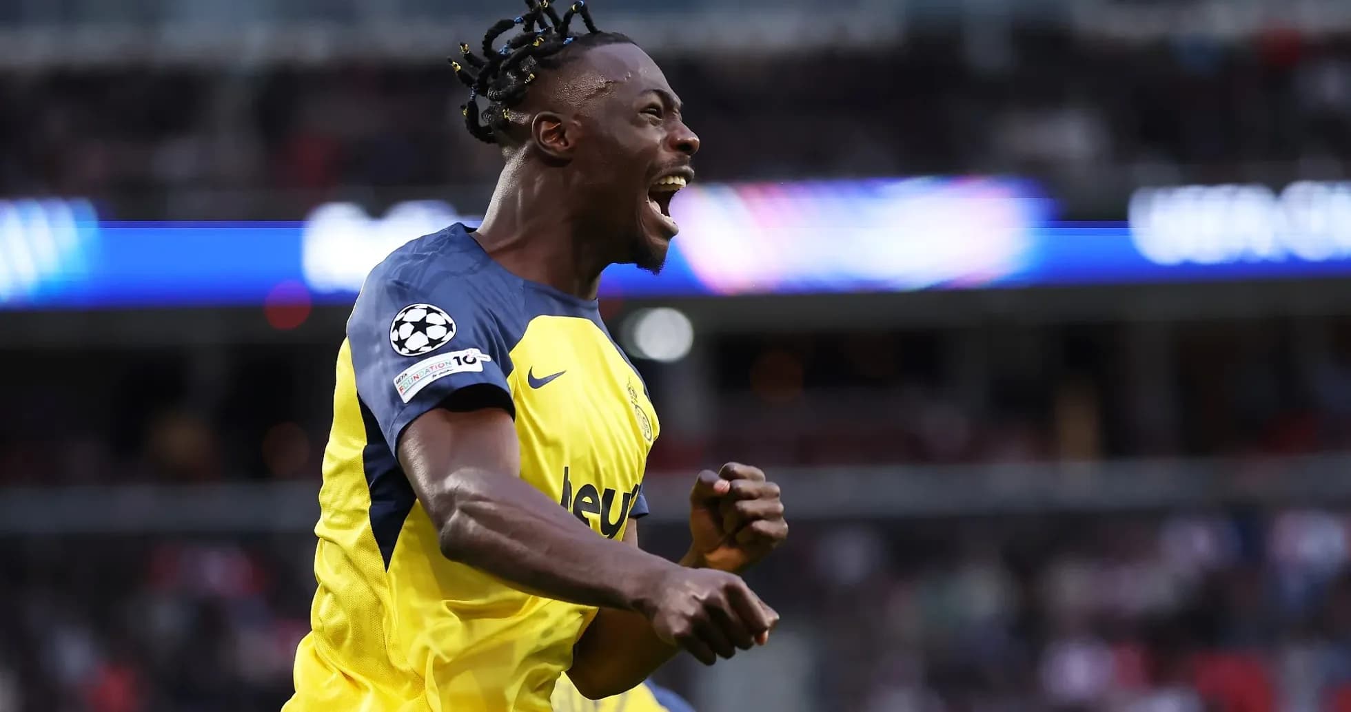 Player celebrating goal in UEFA Champions League Player celebrating goal in UEFA Champions League