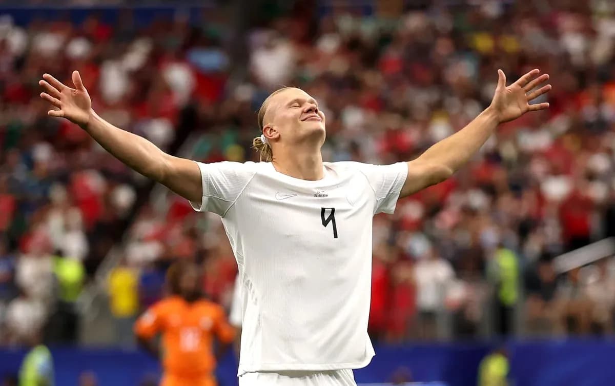 Player celebrating with arms outstretched on field Player celebrating with arms outstretched on field