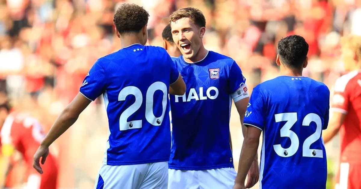 Players celebrating in blue jerseys during match Players celebrating in blue jerseys during match