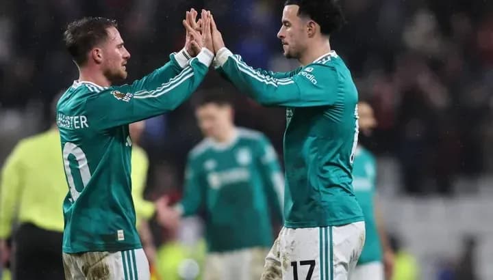 Two players celebrating with high five after match Two players celebrating with high five after match