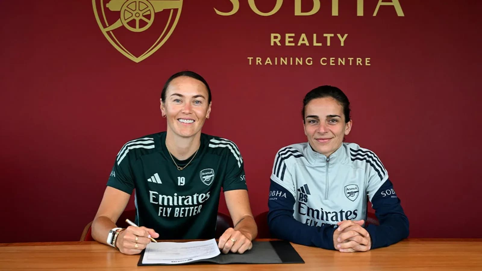 Two players signing contracts at Arsenal training centre Two players signing contracts at Arsenal training centre