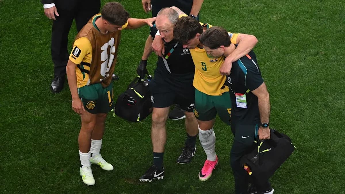 Player receiving assistance after an injury on field Player receiving assistance after an injury on field