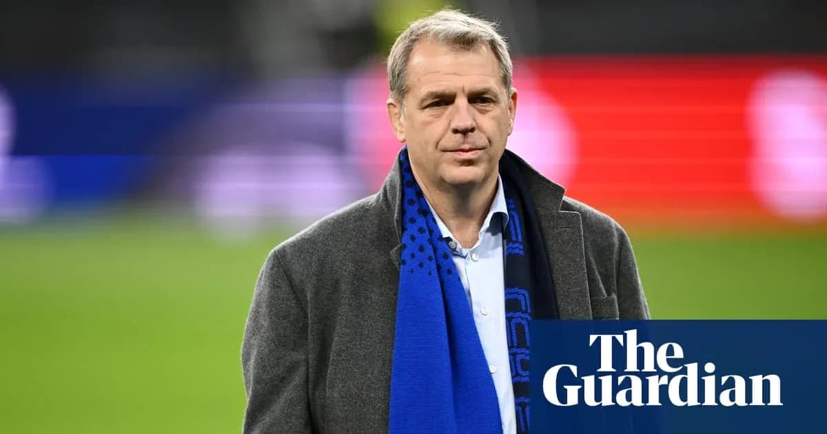 Man in a coat and scarf on the field Man in a coat and scarf on the field