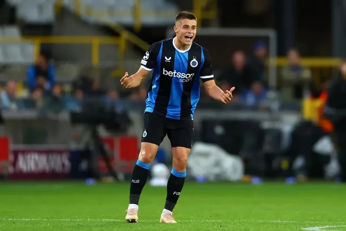 Player celebrating during a UEFA Champions League match Player celebrating during a UEFA Champions League match