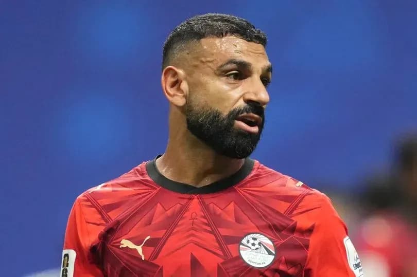 Football player in red jersey during match Football player in red jersey during match