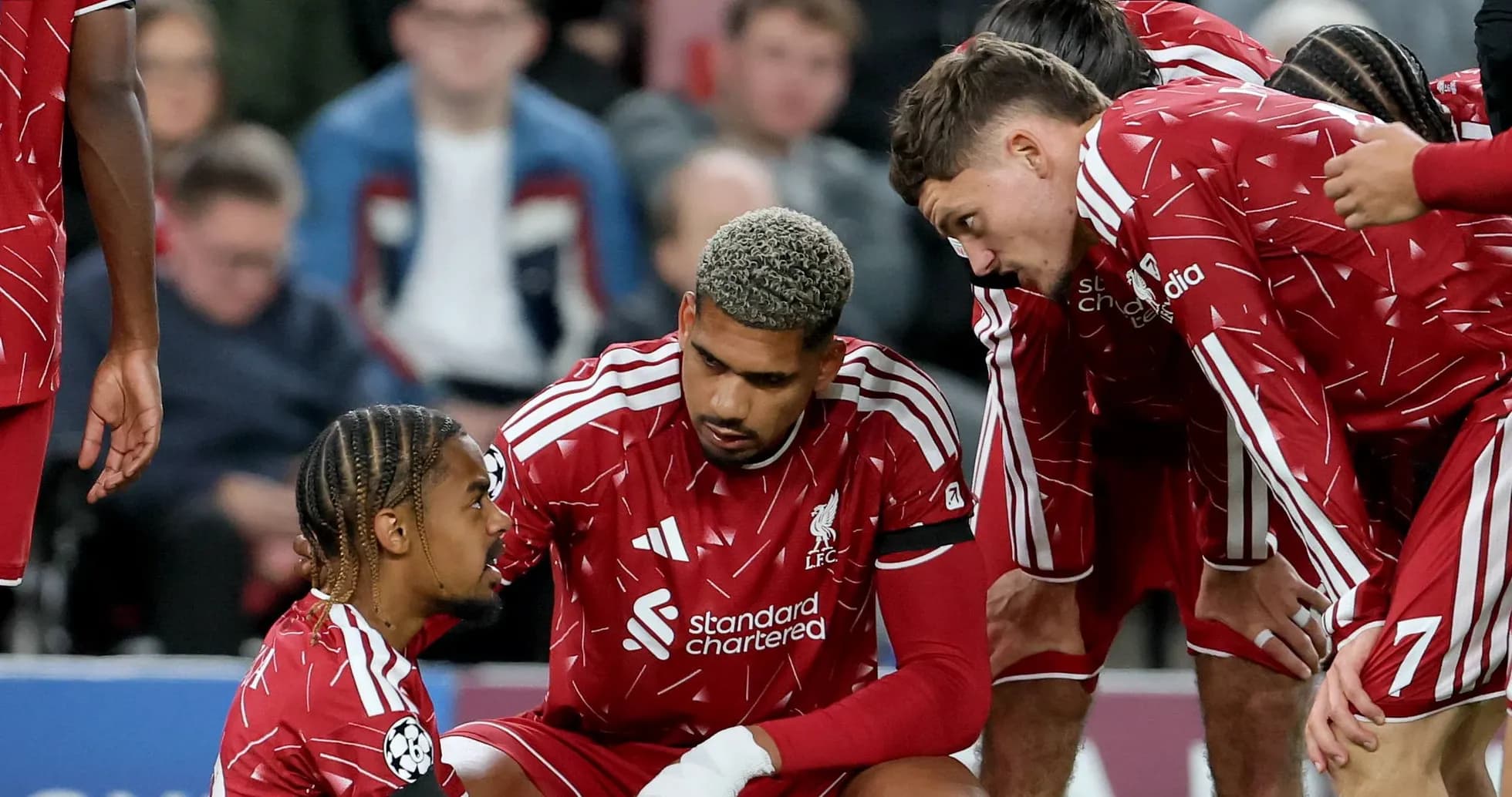 Liverpool players discussing during a match huddle Liverpool players discussing during a match huddle