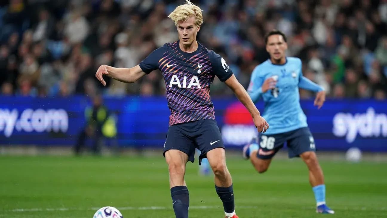 Player kicking the ball during a football match Player kicking the ball during a football match