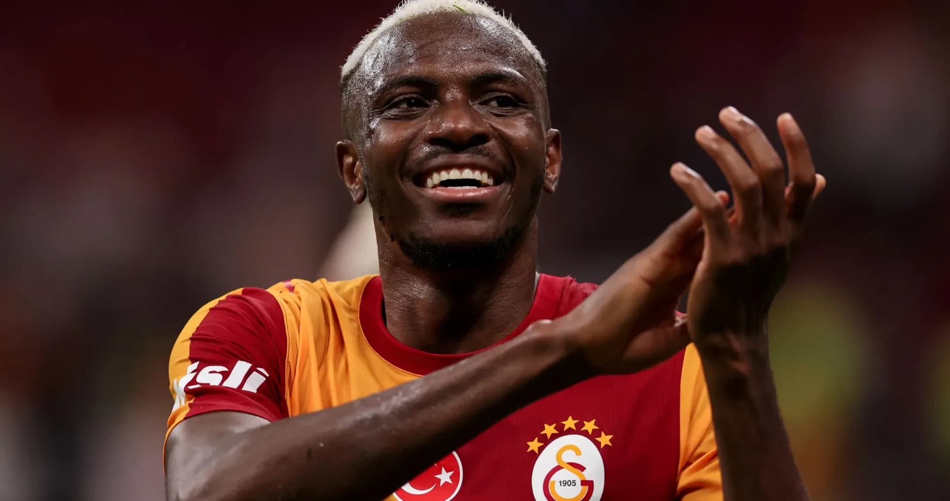 Player celebrating after a match wearing Galatasaray jersey Player celebrating after a match wearing Galatasaray jersey