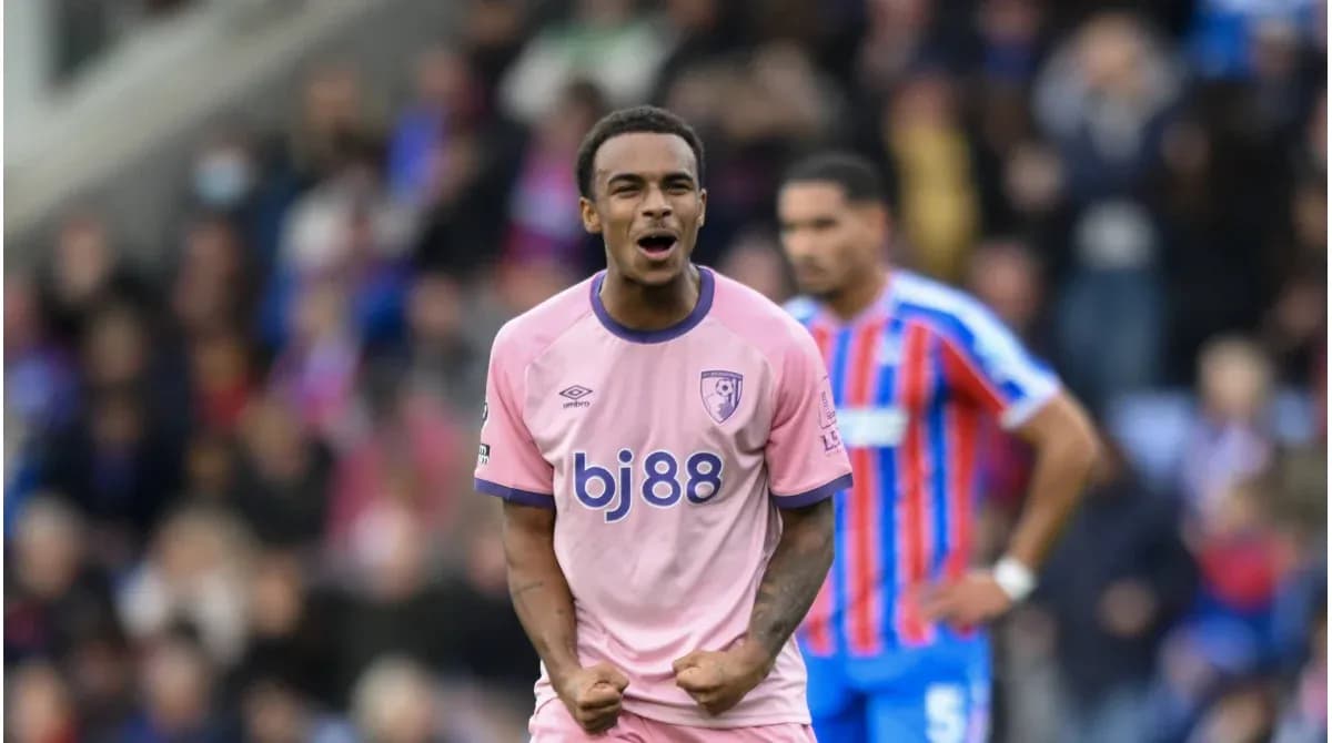 Player celebrating in pink jersey during match Player celebrating in pink jersey during match