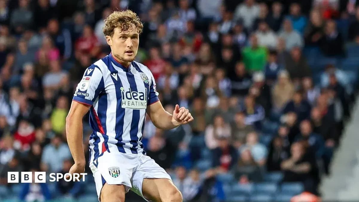Player in striped West Bromwich Albion kit on pitch Player in striped West Bromwich Albion kit on pitch