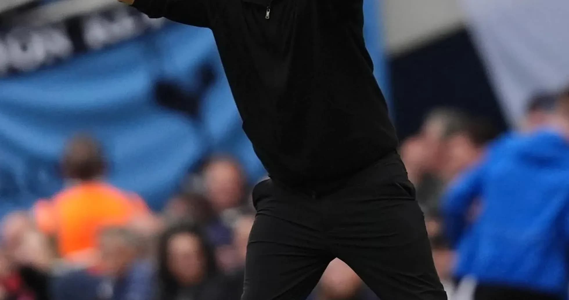 Coach gesturing from the sideline during match Coach gesturing from the sideline during match