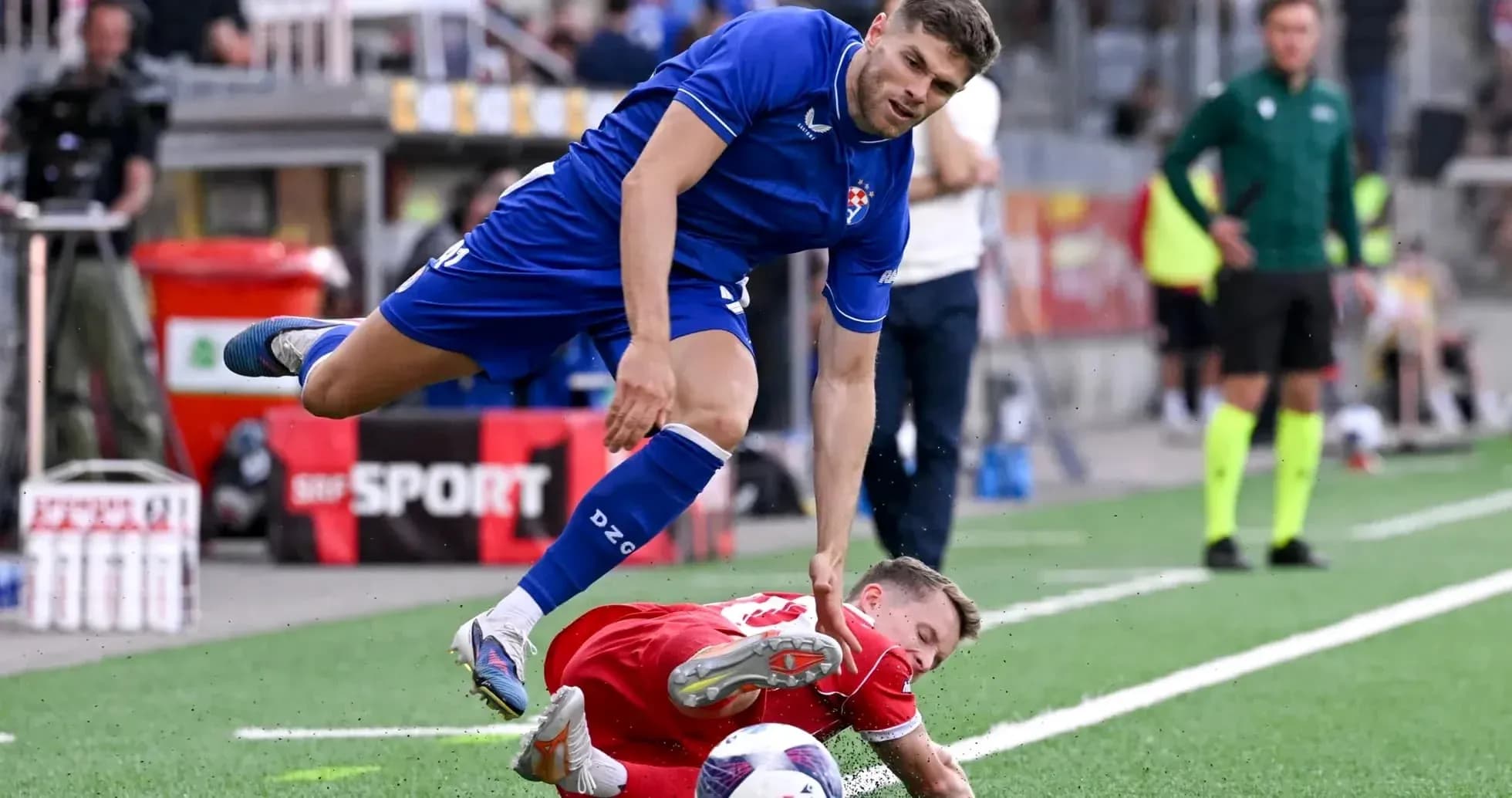 Dinamo Zagreb player tackling FC Thun opponent Dinamo Zagreb player tackling FC Thun opponent