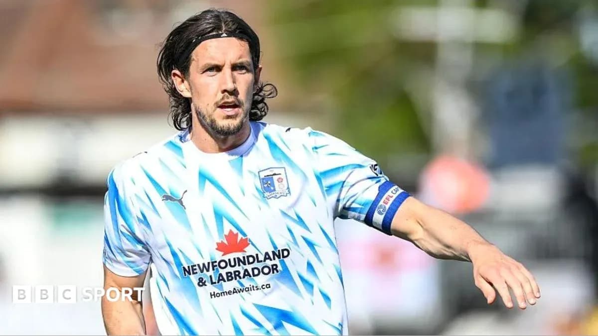 Player in blue and white jersey on field Player in blue and white jersey on field