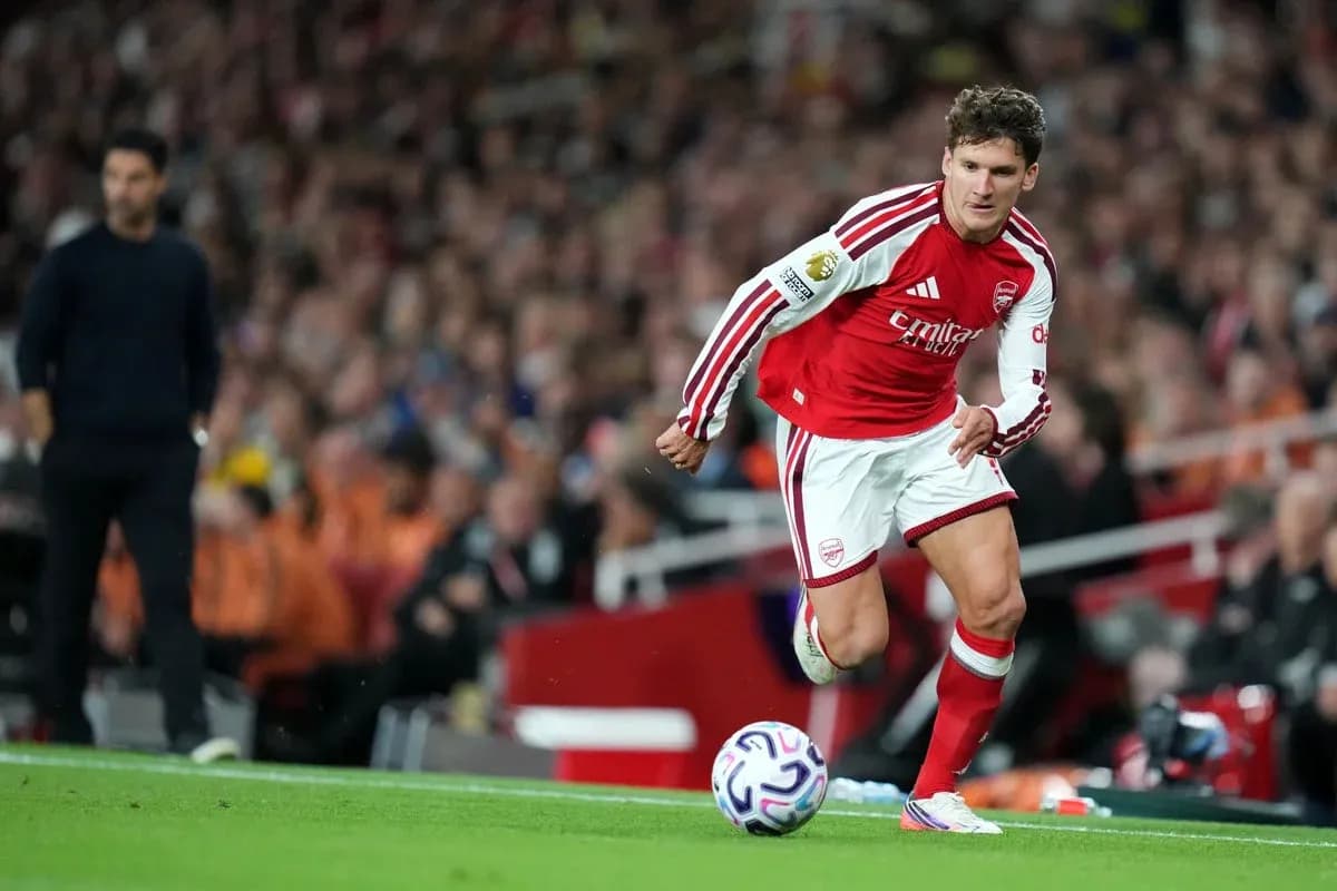 Arsenal player running with the ball during match Arsenal player running with the ball during match