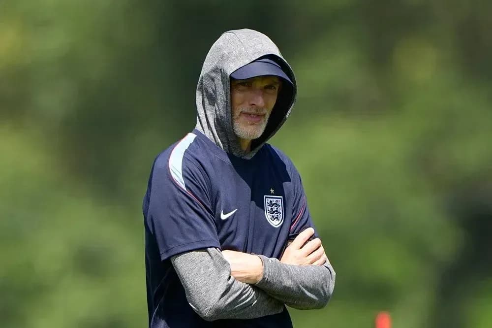 Coach observing training session in hoodie Coach observing training session in hoodie