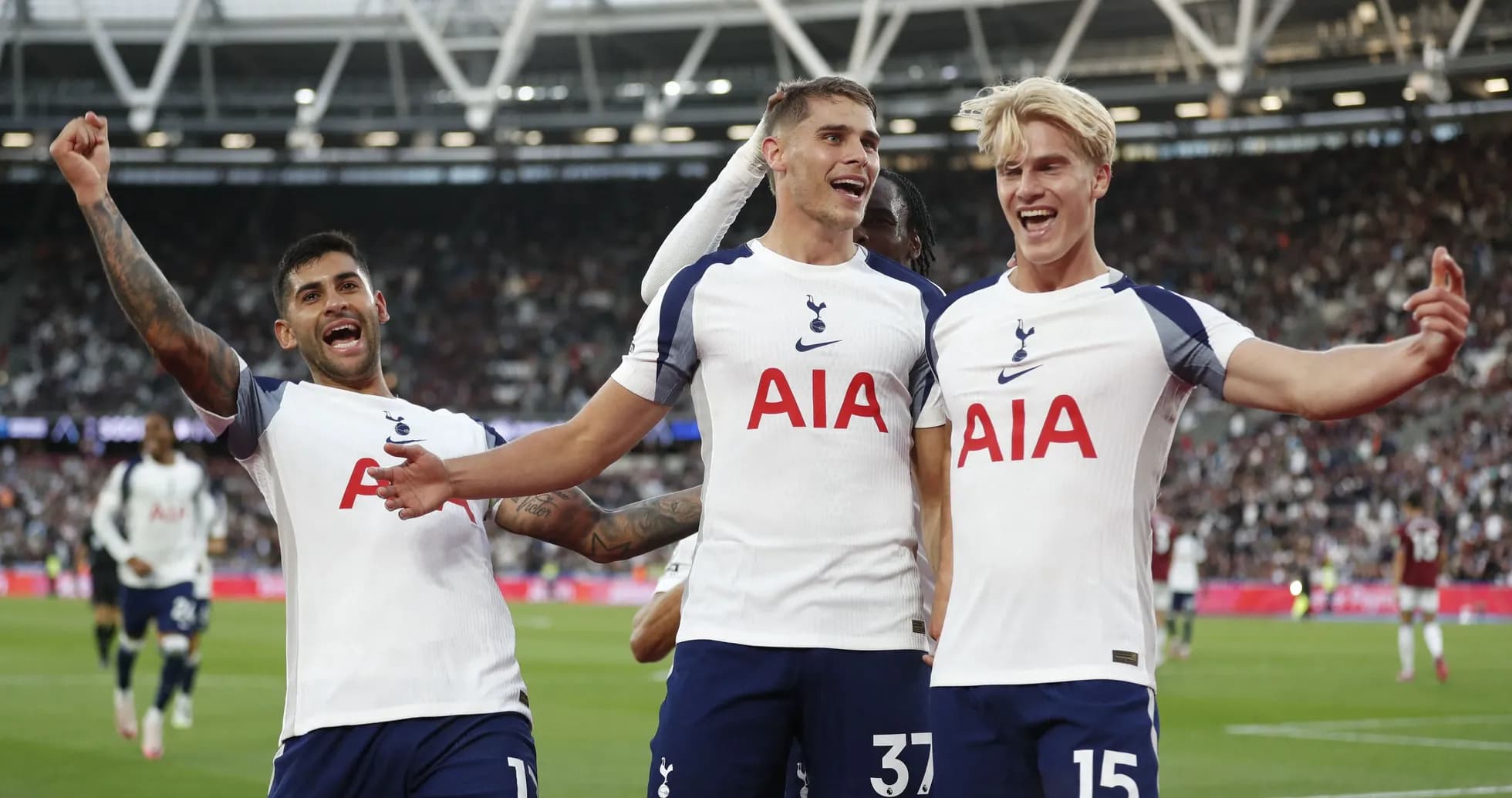 Tottenham players celebrating a goal on the field Tottenham players celebrating a goal on the field