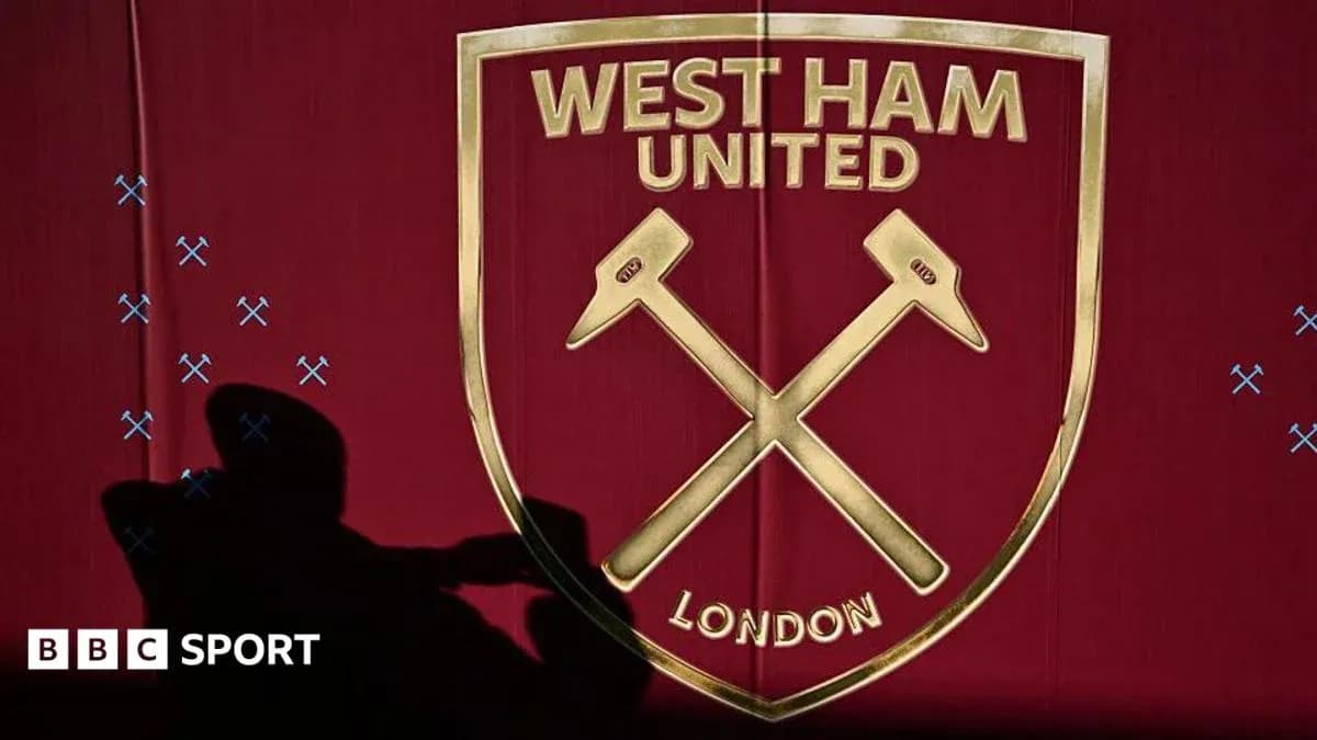 West Ham United logo on red background West Ham United logo on red background