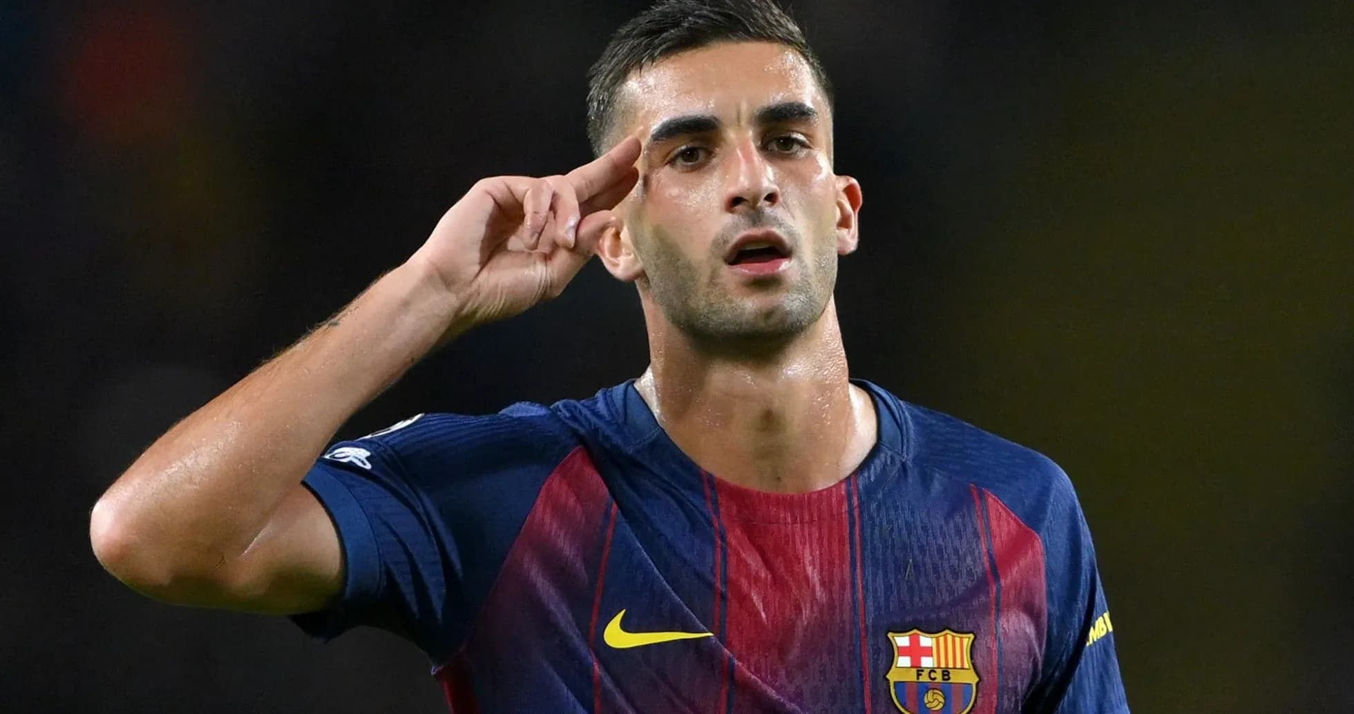 Player celebrating with a salute gesture on field Player celebrating with a salute gesture on field