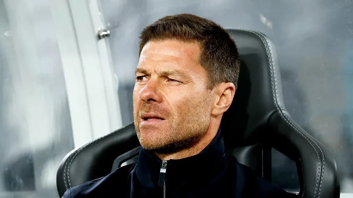Coach seated on bench during a match Coach seated on bench during a match