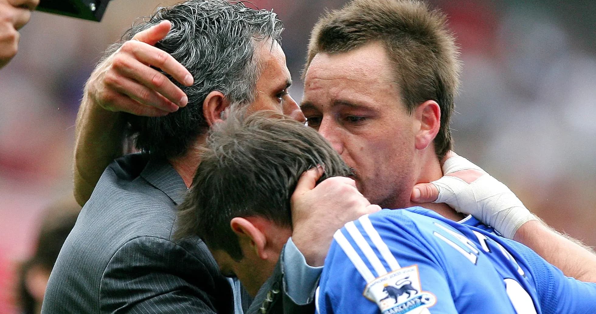 Players embracing after a match with a coach Players embracing after a match with a coach