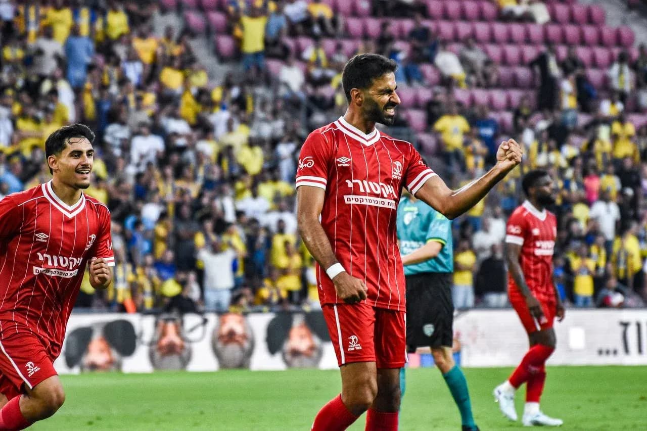 Hapoel Beer Sheva players celebrating in match Hapoel Beer Sheva players celebrating in match