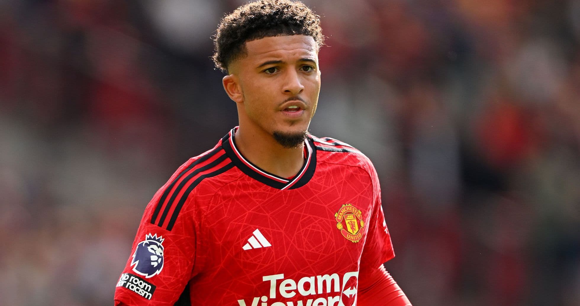 Player in Manchester United red kit on field Player in Manchester United red kit on field