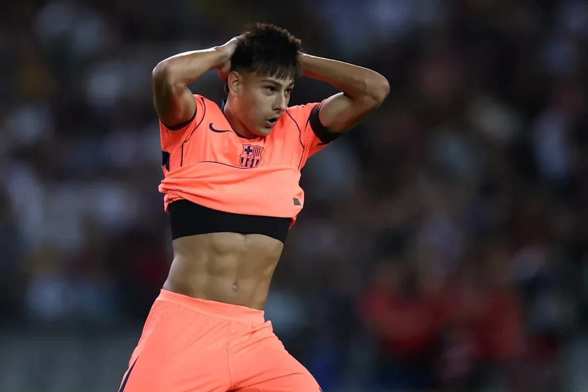 Player adjusting jersey during match in bright kit Player adjusting jersey during match in bright kit