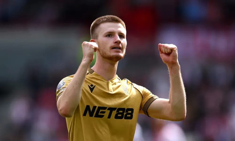 Player celebrating with raised fists on field Player celebrating with raised fists on field