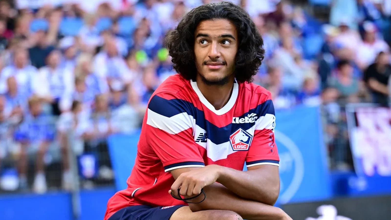 Player sitting on the sidelines during match Player sitting on the sidelines during match