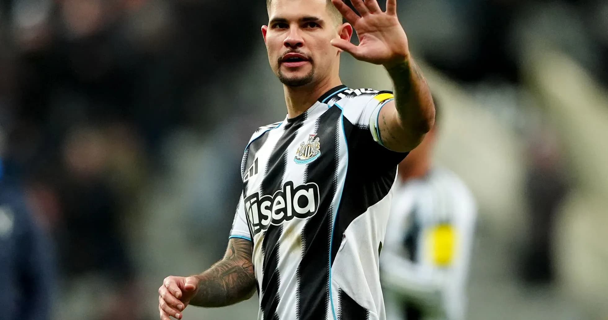 Newcastle player gesturing to fans during match Newcastle player gesturing to fans during match