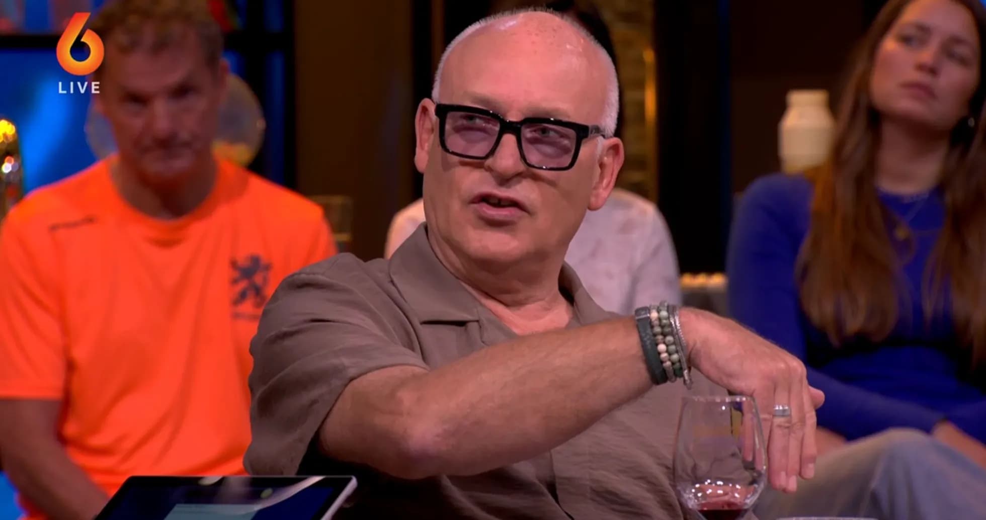 Man gesturing during a talk show discussion Man gesturing during a talk show discussion