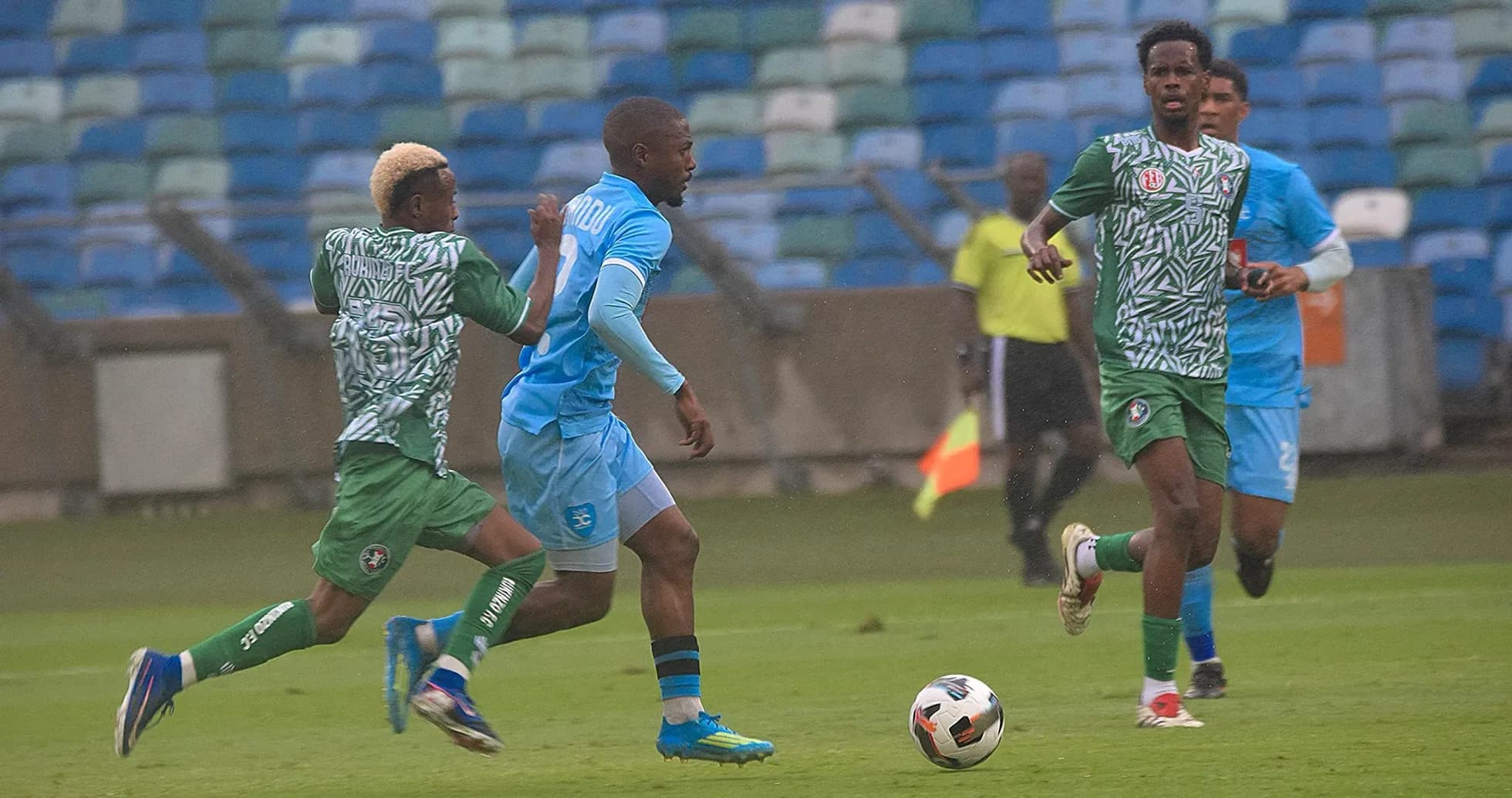 Rukinzo player dribbling against Durban City defenders Rukinzo player dribbling against Durban City defenders