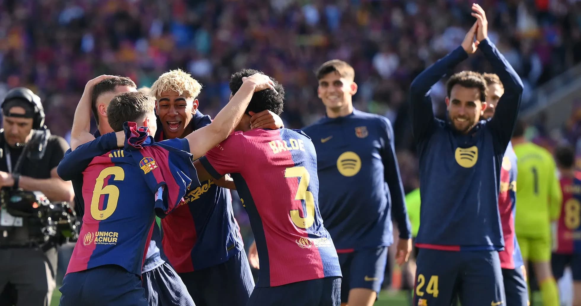 Barcelona players celebrating together on the pitch Barcelona players celebrating together on the pitch