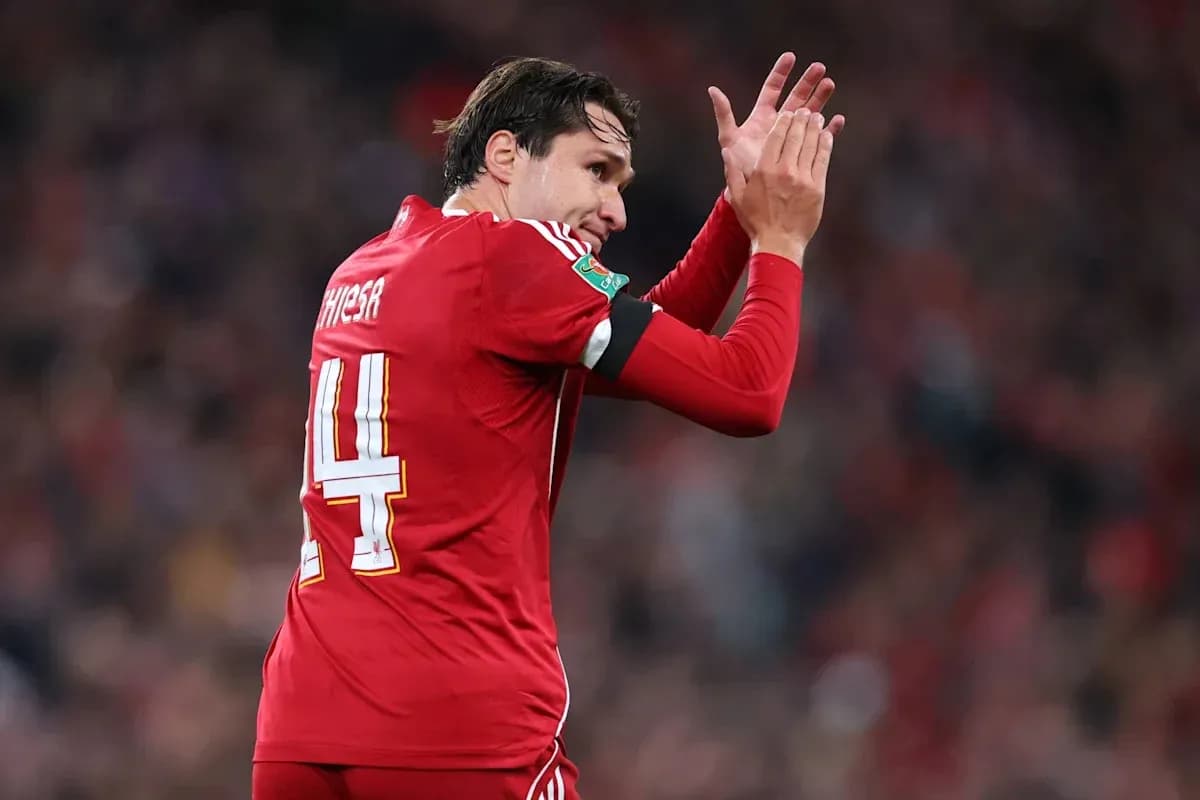 Player applauding fans while wearing red jersey Player applauding fans while wearing red jersey