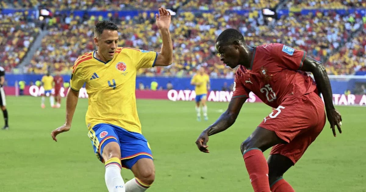Colombian player defending against Moroccan opponent during match Colombian player defending against Moroccan opponent during match