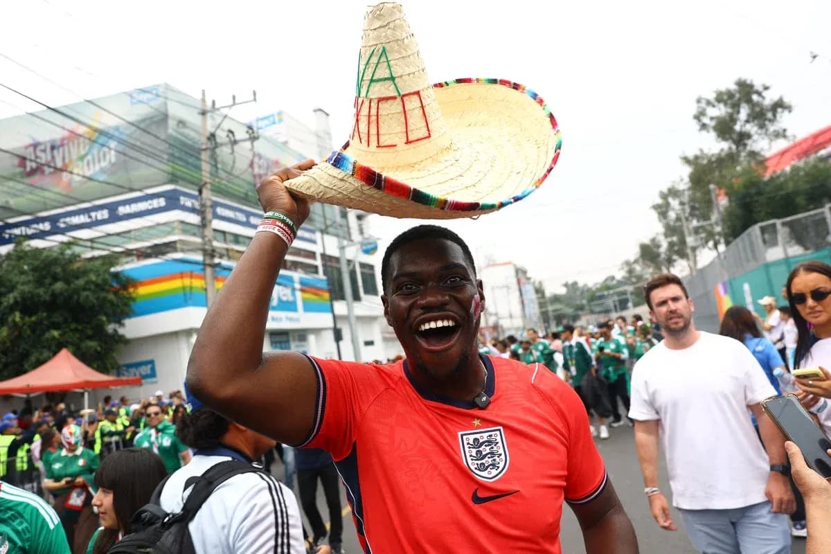 Fan in England jersey celebrating with sombrero hat Fan in England jersey celebrating with sombrero hat